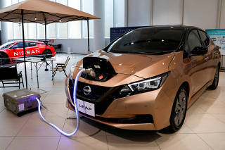 FILE PHOTO: FILE PHOTO: Leaf EV car and portable battery on display at Nissan Gallery in Yokohama
