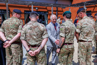 Britain's King Charles visits the 3 Royal School of Military Engineering, in Minley