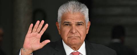 Panama's president-elect Jose Raul Mulino wave to the media before his official meeting with president Laurentino Cortizo at the Presidential Palace in Panama city May 7, 2024. (Photo by MARTIN BERNETTI / AFP)