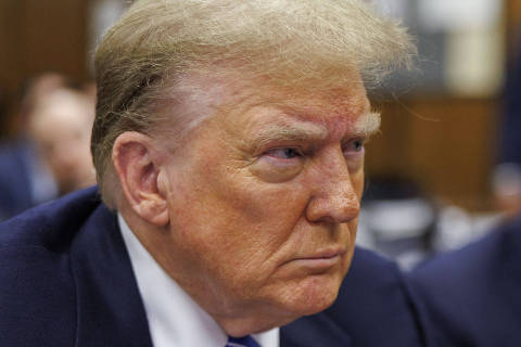 Former US President Donald Trump looks on during his criminal trial for allegedly covering up hush money payments at Manhattan Criminal Court, in New York City, on May 13, 2024. Donald Trump's criminal trial in New York was expected to hear his former lawyer turned tormentor Michael Cohen testify Monday about his role in what prosecutors say was a cover up of payments to hide an affair. (Photo by SARAH YENESEL / POOL / AFP) ORG XMIT: 0513_TrumpPool16