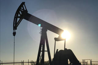 FILE PHOTO: An oil pump is seen operating in the Permian Basin near Midland
