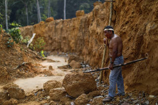 An Indigenous named Raimundo Praia from Mura people looks on in a deforested area of a non-demarcated indigenous land in the Amazon rainforest near Humaita