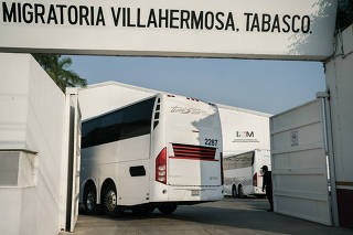Migration agents at a center on the outskirts of Villahermosa, Tamaulipas, Mexico receive buses with migrants brought from Mexico City, on April 26, 2024. (Luis Antonio Rojas/The New York Times)