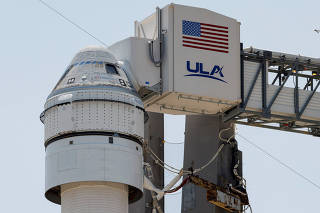 A United Launch Alliance Atlas V rocket stands on the pad after the launch of two astronauts aboard Boeing's Starliner-1 Crew Flight Test (CFT) was delayed, in Cape Canaveral