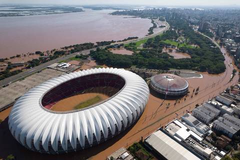 TOPSHOT - Aerial view of the flooded Beira-Rio stadium of the Brazilian football team Internacional in Porto Alegre, Rio Grande do Sul state, Brazil, on May 6, 2024. The rains may have abated, but floodwaters continued their assault on southern Brazil Monday, with hundreds of municipalities in ruins amid fears that food and drinking water may soon run out. (Photo by Renan MATTOS / Renan Mattos / Agencia RBS / AFP / AFP)