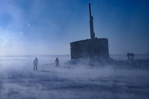 U.S. Navy personnel carry out their duties in temperatures of minus-40 degrees Fahrenheit after the fast-attack submarine USS Hampton surfaced in the Beaufort Sea, a marginal sea of the Arctic Ocean during Operation Ice Camp, March 16, 2024  (Kenny Holston/The New York Times) ORG XMIT: XNYT0788