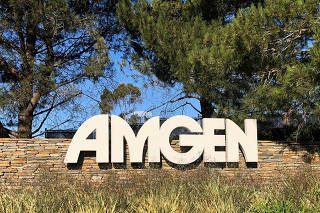 FILE PHOTO: An Amgen sign is seen at the company's headquarters in Thousand Oaks