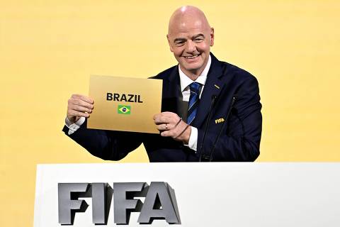 FIFA President Gianni Infantino announces Brazil as the hosts of the 2027 Women's World Cup during the 74th FIFA Congress in Bangkok on May 17, 2024. The 74th FIFA Congress is taking place in Bangkok with member associations voting on a range of issues including confirmation of the host nation or nations for the 2027 women's football World Cup. (Photo by Manan VATSYAYANA / AFP)