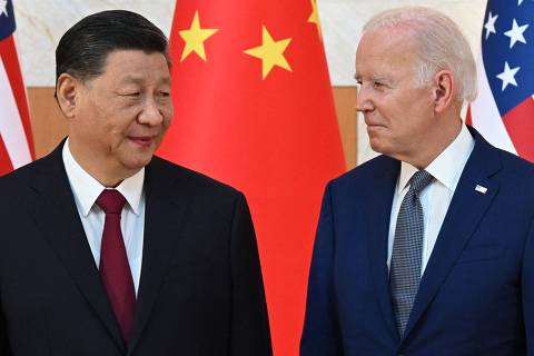 (FILES) US President Joe Biden (R) and China's President Xi Jinping (L) meet on the sidelines of the G20 Summit in Nusa Dua on the Indonesian resort island of Bali on November 14, 2022. President Joe Biden and Xi Jinping spoke on the phone on April 2, 2024. in a new bid to manage tensions between the United States and China, with top US officials to head shortly to Beijing, officials said. (Photo by SAUL LOEB / AFP)