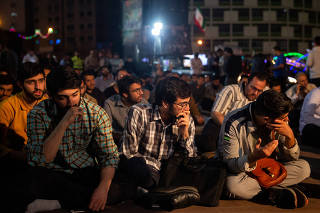People gather to pray for President Ebrahim Raisi in Tehran, Iran, after a helicopter carrying him and Foreign Minister Hossein Amir Abdollahian crashed on Sunday in a remote part of the country, May 19, 2024. (Arash Khamooshi/The New York Times)