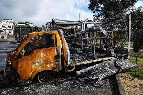 A burnt vehicle is seen in the Normandy industrial zone in Noumea, France's Pacific territory of New Caledonia, on May 20, 2024. Separatists in riot-hit New Caledonia refused on May 20 to abandon road blocks that have paralysed much of the Pacific archipelago and halted commercial air traffic, defying a major security operation by French forces. (Photo by Theo Rouby / AFP) ORG XMIT: NEW-CALEDONIA-NOUMEA-CONFLICT-SU