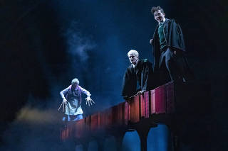 From left: Judith Lightfoot Clarke, Brady Dalton Richards and James Romney in the new version of the play ?Harry Potter and the Cursed Child,? at the Lyric Theater in Manhattan, Oct. 10, 2021. (Sara Krulwich/The New York Times)