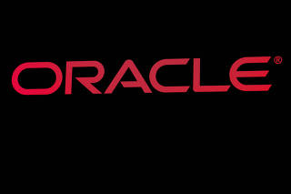 FILE PHOTO: FILE PHOTO: The company logo for Oracle Corp. is displayed on a screen on the floor at the NYSE in New York