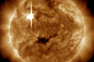 FILE PHOTO: The Sun emits a solar flare