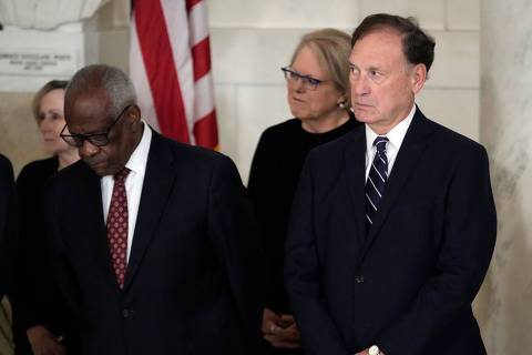 Supreme Court Justice Clarence Thomas and Justice Samuel Alito attend a private ceremony for retired Supreme Court Justice Sandra Day OConnor before public repose in the Great Hall at the Supreme Court in Washington, DC, on December 18, 2023. O'Connor, the first woman US Supreme Court justice, died on December 1, 2023 at 93 of complications related to advanced dementia and a respiratory illness. She served as one of the nine justices on the court until 2006 and wielded enormous influence as a crucial 