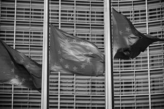 FILE PHOTO: European Union flags fly outside the European Commission headquarters in Brussels