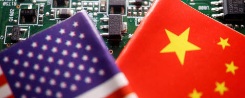 FILE PHOTO: Flags of China and U.S. are displayed on a printed circuit board with semiconductor chips, in this illustration picture taken February 17, 2023. REUTERS/Florence Lo/Illustration/File Photo ORG XMIT: FW1