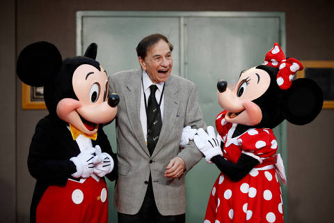 FILE PHOTO: Mickey Mouse, songwriter Richard M. Sherman and Minnie Mouse pose during a dedication of Stage A on The Walt Disney Studios Lot to the Sherman Brothers, songwriters Richard M. Sherman and Robert B. Sherman, before the World Premiere of Disney's 