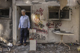 Yuval Bitton visits the former home of a nephew who was taken in the October 7 attack, at Kibbutz Nir Oz, Israel on Feb. 7, 2024.  (Avishag Shaar-Yashuv/The New York Times)