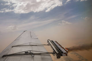 Hygroscopic flares are released during a cloud seeding flight in United Arab Emirates