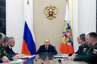 Russian President Putin meets with commanders of troops of military districts, in Moscow