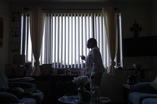 Yvonne Holden, whose son Al died in 2021 of an overdose on his 50th birthday, at her apartment in Baltimore, Sept. 15, 2023. (Jessica Gallagher/The Baltimore Banner, for The New York Times)