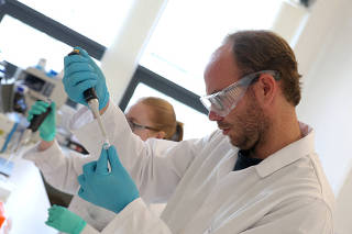 FILE PHOTO: Scientists work at HydRegen, based at University of Oxford Begbroke Science Park, in Kidlington