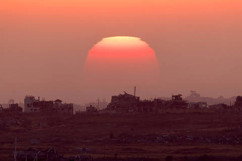 The sun sets over the Gaza Strip, amid the ongoing conflict between Israel and the Palestinian Islamist group Hamas, as seen from Israel, June 2, 2024. REUTERS/Amir Cohen ORG XMIT: LIVE
