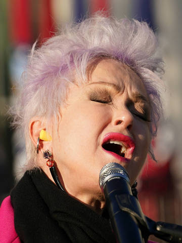 Artist Cyndi Lauper performs during a signing ceremony for the 