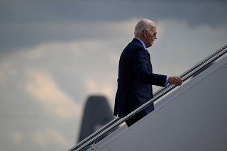 U.S. President Joe Biden boards Air Force One as he departs for Connecticut from Delaware Air National Guard Base, in New Castle