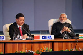 FILE PHOTO: Indian Prime Minister Narendra Modi and China's President Xi Jinping attend the BRICS summit meeting in Johannesburg