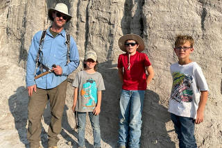 Paleontologist Tyler Lyson and a three of young fossil finders ? Liam Fisher, Jessin Fisher and Kaiden Madsen