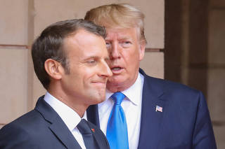 FILE PHOTO: U.S. President Donald Trump and French President Emmanuel Macron meet at the Prefecture of Caen, Normandy