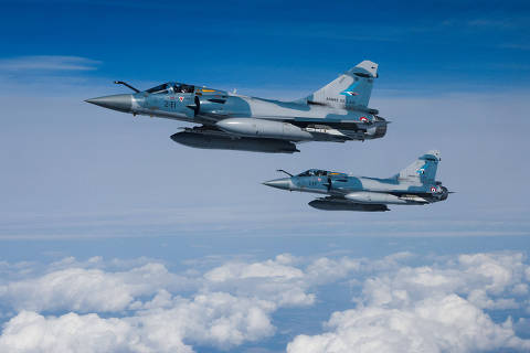 FILE PHOTO: Two Mirage 2000-5F fighter jets of the French Air Force are seen next to an Airbus A330 MRTT 