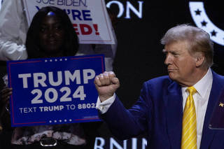 FILE PHOTO: FILE PHOTO: Former U.S. President Donald Trump attends a Turning Point USA event at the Dream City Church in Phoenix