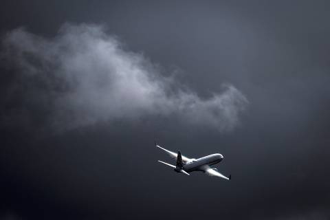 A Virgin Australia Airlines Boeing 737 plane flies as a storm approaches at Sydney International Airport on June 7, 2024. (Photo by DAVID GRAY / AFP) ORG XMIT: DBG200