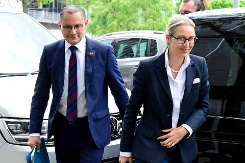 Co-leaders of Germany's far-right Alternative for Germany (AfD) party Alice Weidel (R) and Tino Chrupalla arrive for a press conference in Berlin on June 10, 2024, one day after European Parliament elections. (Photo by JOHN MACDOUGALL / AFP)
