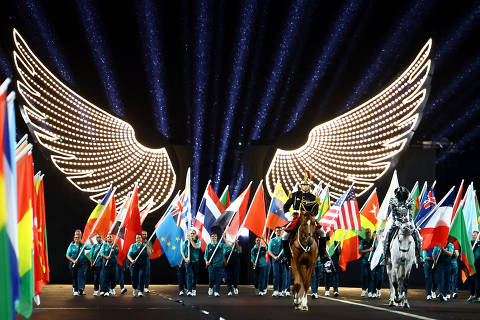 Paris 2024 Olympics - Opening Ceremony - Paris, France - July 26, 2024. Flags of the competing countries arrive at the Place du Trocadero during the opening ceremony. REUTERS/Edgar Su