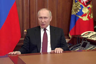 FILE PHOTO: Russian President Vladimir Putin speaks about authorising a special military operation in Ukraine's Donbass region during a special televised address on Russian state TV, in Moscow