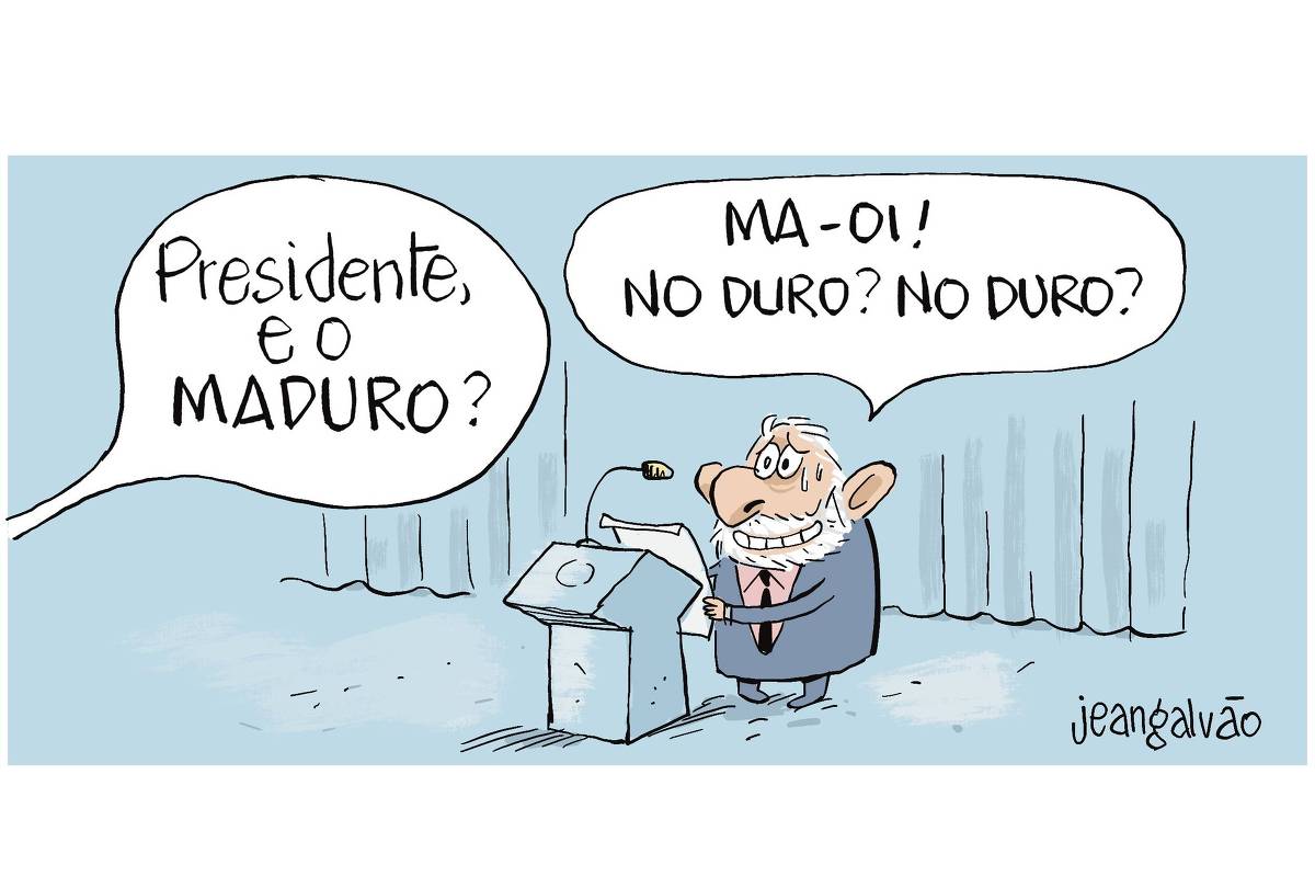 Charge de Jean Galvão retrata o presidente Lula em pé atrás de um púlpito, como se estivesse respondendo a perguntas de jornalistas. Um balão de fala traz a pergunta: “Lula, e o Maduro?”. A expressão de Lula é de desconforto. Ele está visivelmente suando e tentando manter um sorriso sem graça enquanto responde de forma evasiva, dizendo: “MA-OI! NO DURO? NO DURO?”.