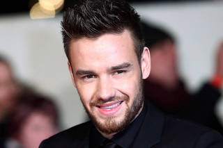 FILE PHOTO: Singer Liam Payne poses for photographers at the world premiere of the film 