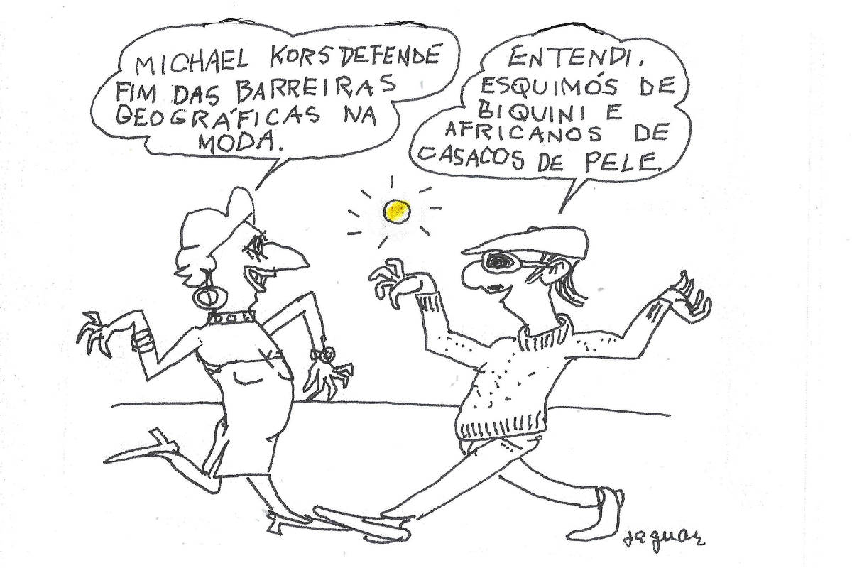 Uma ilustração em estilo de cartoon apresenta duas figuras conversando. A primeira figura, uma mulher com cabelo curto e vestido justo, diz: 'MICHAEL KORS DEFENDE FIM DAS BARREIRAS GEOGRÁFICAS NA MODA.' A segunda figura, um homem usando óculos escuros e um boné, responde: 'ENTENDI, ESQUIMÓS DE BIQUINI E AFRICANOS DE CASACOS DE PELE.' Ao fundo, há um sol amarelo.