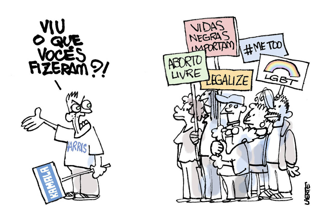 Um grupo de pessoas variadas, negros, mulheres, idosas, está parado, com placas onde está escrito “ABORTO LIVRE”, “LEGALIZE”, “VIDAS NEGRAS IMPORTAM”, “#METOO”, “LGBT”. À frente deles um homem com camiseta de “HARRIS” e uma placa de “KAMALA”, se dirige ao grupo, furioso, apontando algo logo adiante e dizendo: “Viu o que vocês fizeram?!”