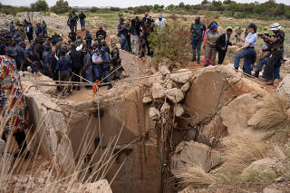 South African police in standoff with hundreds of illegal miners in disused shaft