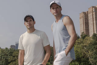 Oren Alexander, left, and his brother Tal Alexander, right, in Manhattan, Sept. 18, 2022. (Natalie Keyssar/The New York Times)