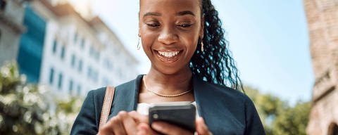 Phone, walking and a business black woman in the city, searching for directions or typing a message. Mobile, smile and gps with a young female employee looking for a location on a navigation app