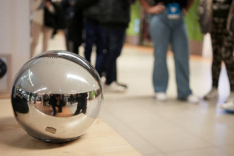 FILE PHOTO: People queue to use WorldCoin's iris-scanners in Madrid, Spain, March 6, 2024. REUTERS/ Antoine Demaison/File Photo ORG XMIT: FW1