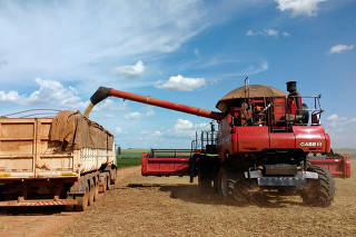 FILE PHOTO: Soybeans are loaded into a truck at a field in the municipality of Campo Verde