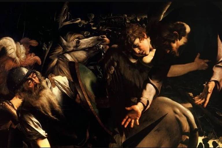 A imagem retrata uma cena dramática com várias figuras em movimento, representando a captura de Cristo. Há um homem no centro, com uma expressão intensa, cercado por outros personagens que parecem estar em ação. A iluminação é dramática, destacando os rostos e as vestes das figuras, enquanto o fundo é escuro, criando um contraste forte.