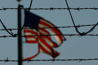 FILE PHOTO: Migrants are transferred to a plane to be expelled from U.S., in El Paso